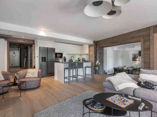 Experience luxury living in this stunning property, featuring a modern kitchen with sleek appliances and a spacious island perfect for entertaining.