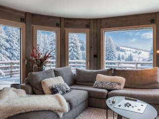 This cozy living room features a comfortable sectional sofa, perfect for relaxing.