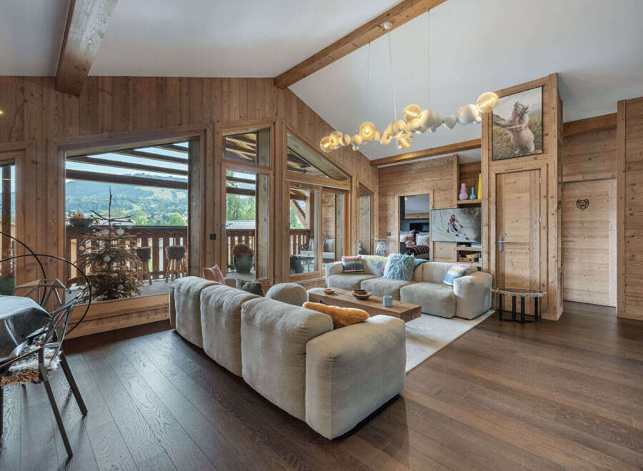 Experience luxury living in this stunning property, featuring a spacious living area with a cozy sofa and a modern design.
