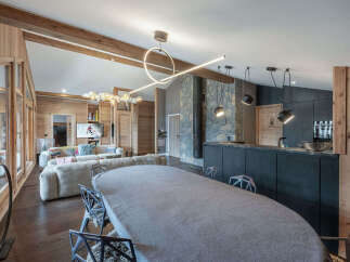 Experience luxury living in this stunning chalet, featuring a spacious open-plan design perfect for entertaining.