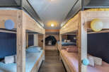 This charming bunk room offers a cozy and inviting space for guests.