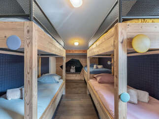 This charming bunk room offers a cozy and inviting space for guests.