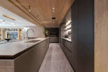 Experience luxury living in this stunning modern kitchen.