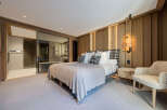 Experience luxury in this stunning bedroom featuring a spacious layout and elegant design.
