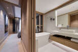 Step into luxury with this stunning bathroom, featuring a sleek, modern design.