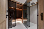 Step into luxury with this stunning spa-like bathroom featuring a modern sauna and a sleek shower.