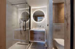 Step into modern luxury with this stunning bathroom design.