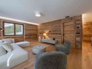 Experience the warmth and charm of this stunning living space, featuring exquisite wood paneling that adds a touch of rustic elegance.