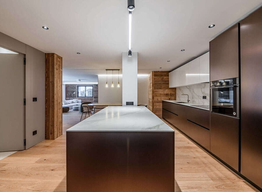 Experience modern luxury in this stunning kitchen! Featuring sleek cabinetry, a spacious island with a marble countertop, and high-end appliances, this space is perfect for both cooking and entertaining.