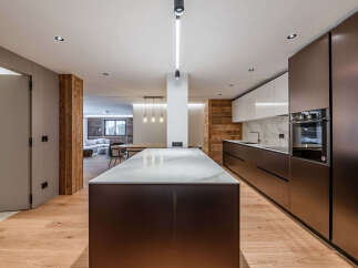 Experience modern luxury in this stunning kitchen! Featuring sleek cabinetry, a spacious island with a marble countertop, and high-end appliances, this space is perfect for both cooking and entertaining.