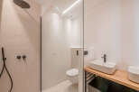 Step into modern luxury with this stunning bathroom design.