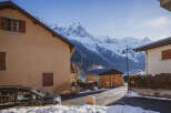 Nestled in a picturesque mountain village, this charming property offers stunning views of the snow-capped peaks.
