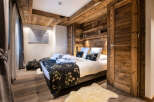 Experience rustic elegance in this stunning bedroom.