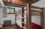 Rustic charm meets modern comfort in this cozy bedroom.