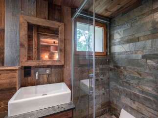 Experience rustic elegance in this stunning bathroom.