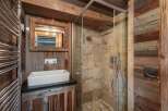 Step into rustic elegance with this stunning bathroom design.