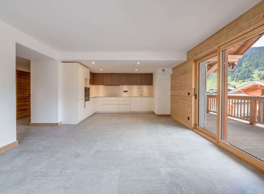This stunning property boasts a modern kitchen with sleek cabinetry and ample counter space, perfect for culinary enthusiasts.