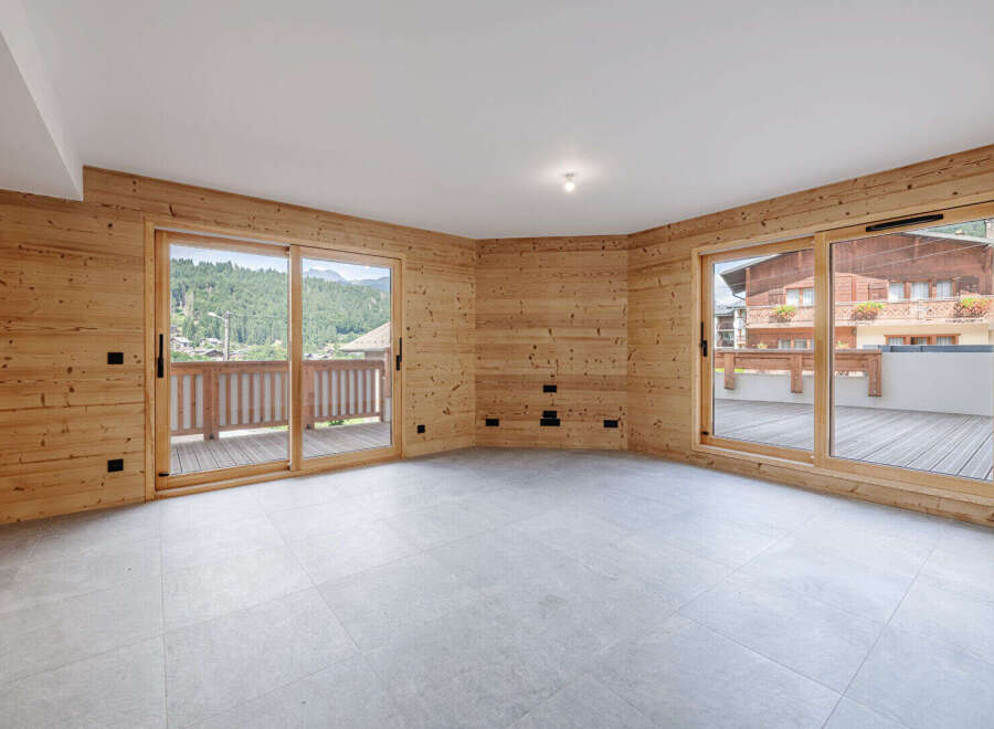 Experience the charm of this stunning property, featuring exquisite wooden accents and expansive windows that flood the space with natural light.