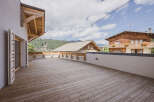 Enjoy breathtaking mountain views from this stunning property featuring a spacious wooden deck.