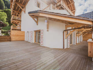 This stunning property boasts a beautiful wooden deck, perfect for enjoying the outdoors.