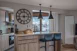 This stunning kitchen boasts a modern design with a touch of rustic charm.
