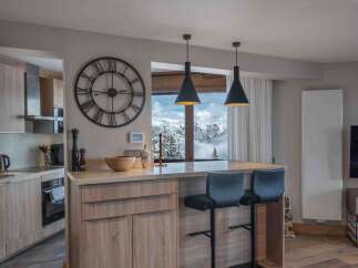 This stunning kitchen boasts a modern design with a touch of rustic charm.