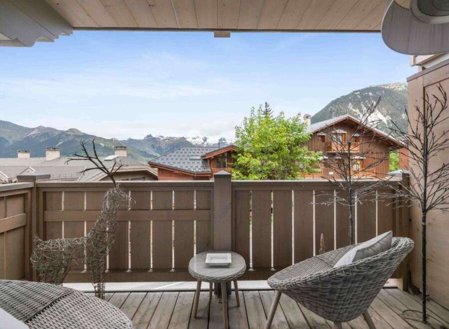 Enjoy breathtaking mountain views from this charming balcony.