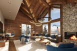 Experience luxury living in this stunning chalet, boasting a cozy fireplace and breathtaking mountain views.