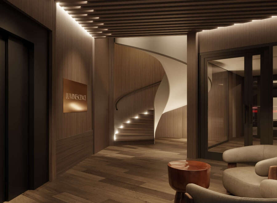 Step into luxury with this stunning property, featuring a grand entrance with a modern spiral staircase.
