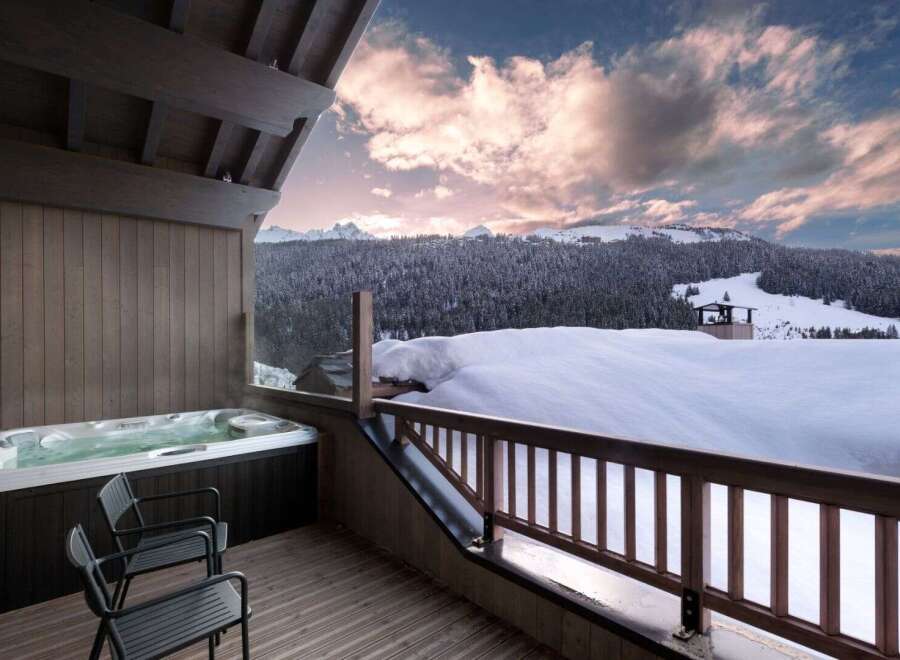 Indulge in luxury with this stunning property featuring a private hot tub overlooking breathtaking mountain views.