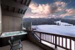 Indulge in luxury with this stunning property featuring a private hot tub overlooking breathtaking mountain views.