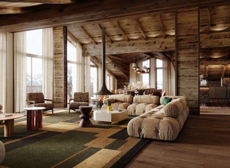 Experience luxury living in this stunning chalet, boasting a cozy fireplace and expansive windows that frame breathtaking mountain views.