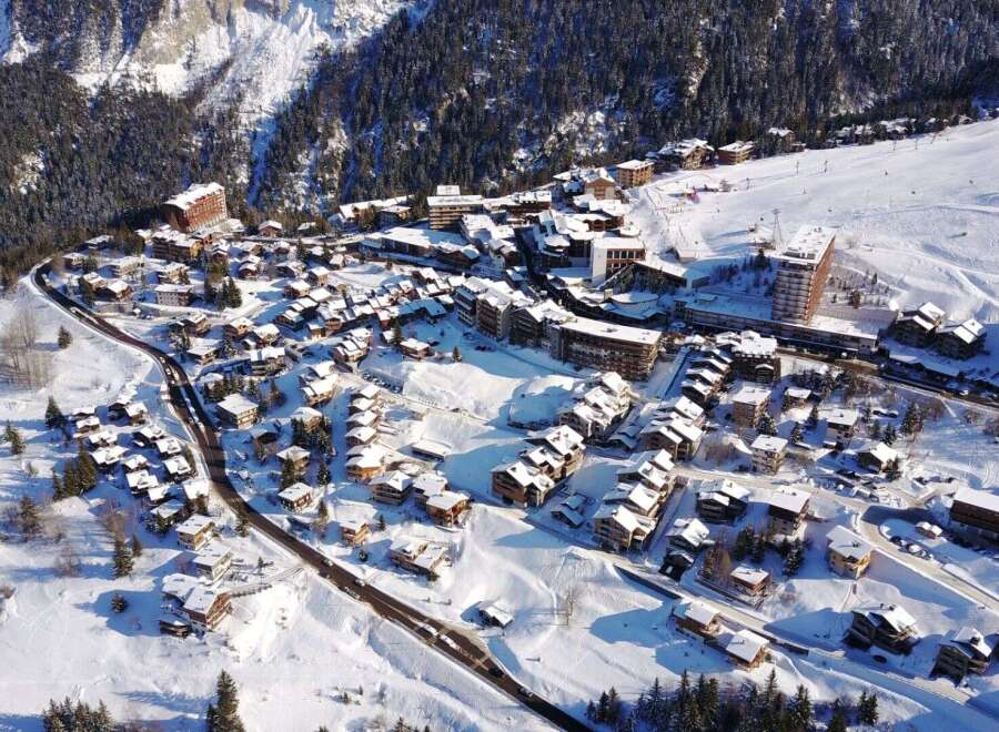 Discover the charm of this stunning mountain village nestled in a winter wonderland.