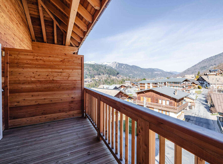 Enjoy breathtaking mountain views from this charming balcony.