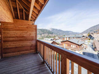 Enjoy breathtaking mountain views from this charming balcony.
