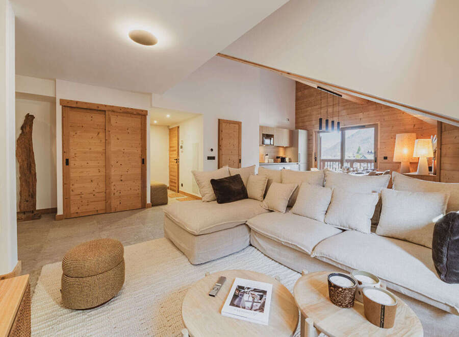 Experience luxury living in this stunning property, featuring a spacious living area with a comfortable sectional sofa and a cozy rug.