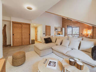 Experience luxury living in this stunning property, featuring a spacious living area with a comfortable sectional sofa and a cozy rug.