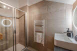 Step into luxury with this stunning bathroom! Featuring a modern shower, heated towel rack, and a sleek sink, this space is designed for ultimate comfort and style.