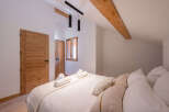 This stunning bedroom boasts a warm and inviting atmosphere, perfect for relaxation.