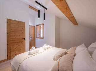 This stunning bedroom boasts a warm and inviting atmosphere, perfect for relaxation.