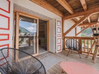 Enjoy breathtaking mountain views from this stunning balcony.