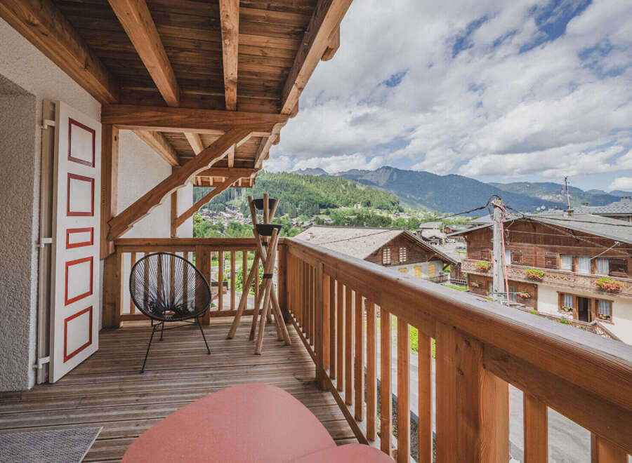 Enjoy breathtaking mountain views from this charming balcony.