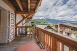 Enjoy breathtaking mountain views from this charming balcony.