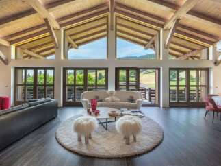 Experience luxury living in this stunning property, featuring expansive windows that frame breathtaking views of the surrounding landscape.