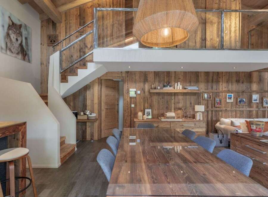This stunning property boasts a rustic yet modern design, perfect for those seeking a luxurious mountain retreat.