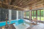Experience luxury and wellness in this stunning indoor pool area.