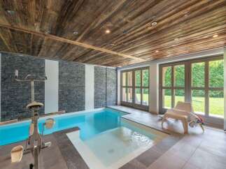 Experience luxury and wellness in this stunning indoor pool area.
