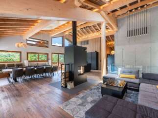 Experience luxury living in this stunning property featuring a modern fireplace, perfect for cozy evenings.
