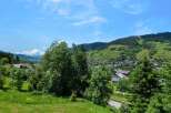 Enjoy breathtaking views from this stunning property nestled in a picturesque mountain village.