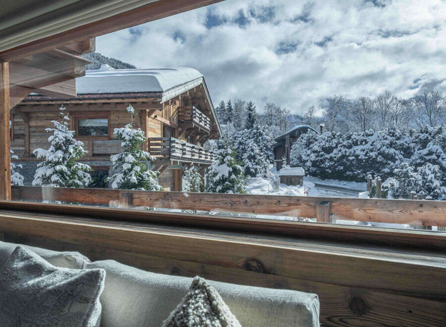 Experience the charm of this stunning wooden chalet nestled in a winter wonderland.